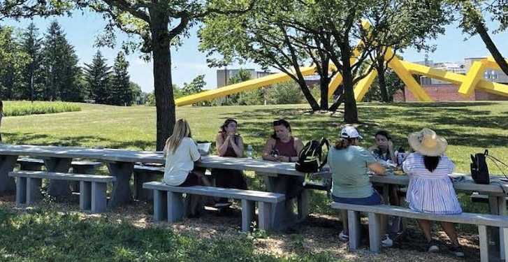 People sitting at a table outside